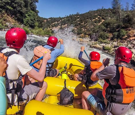 Adventurers on a white water raft
